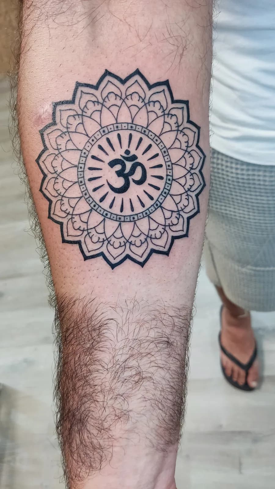 Geometric mandala on the forearm